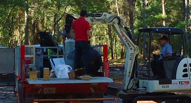 log cabin materials unloading