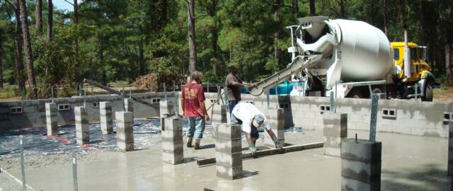 log home cabin foundation pour by Log Home Guys of Florida
